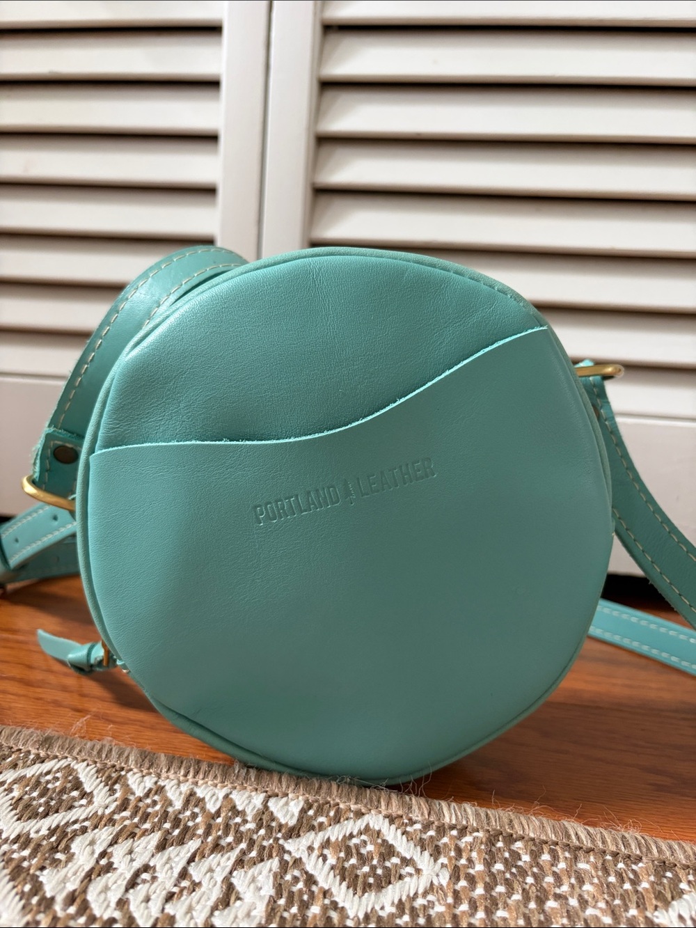 Portland Leather Circle Small Crossbody in “Optical” color